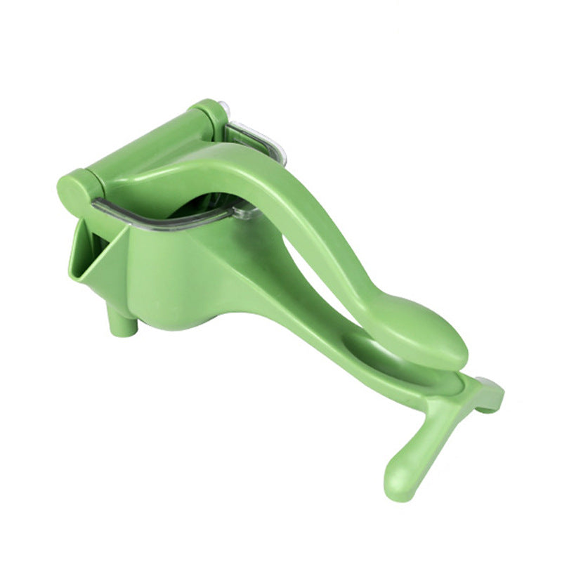 Green manual lemon and fruit juicer on a white background
