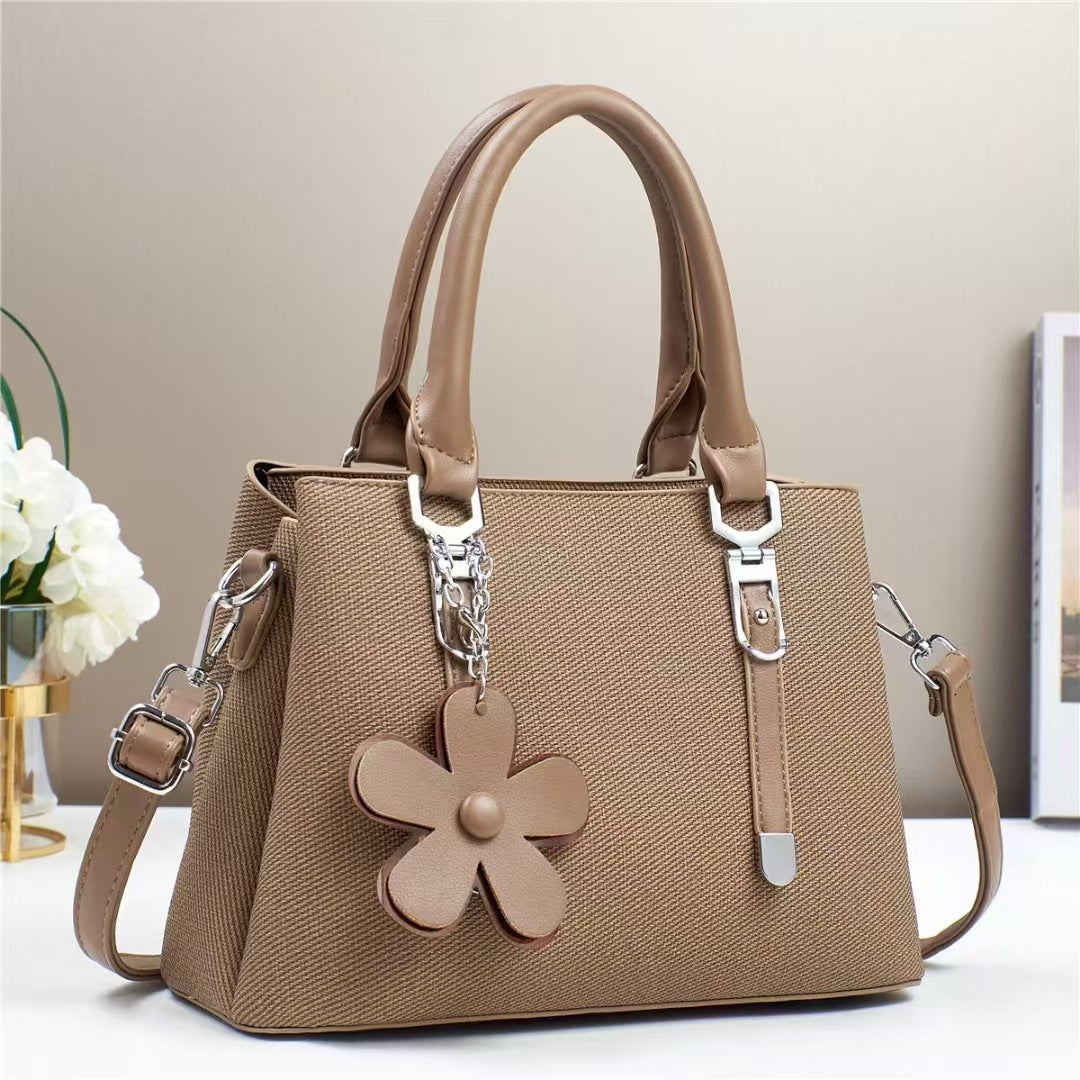 New style handbags are fashionable, simple and stylish, with large capacity and exquisite accessories, and are available for cross-border delivery.