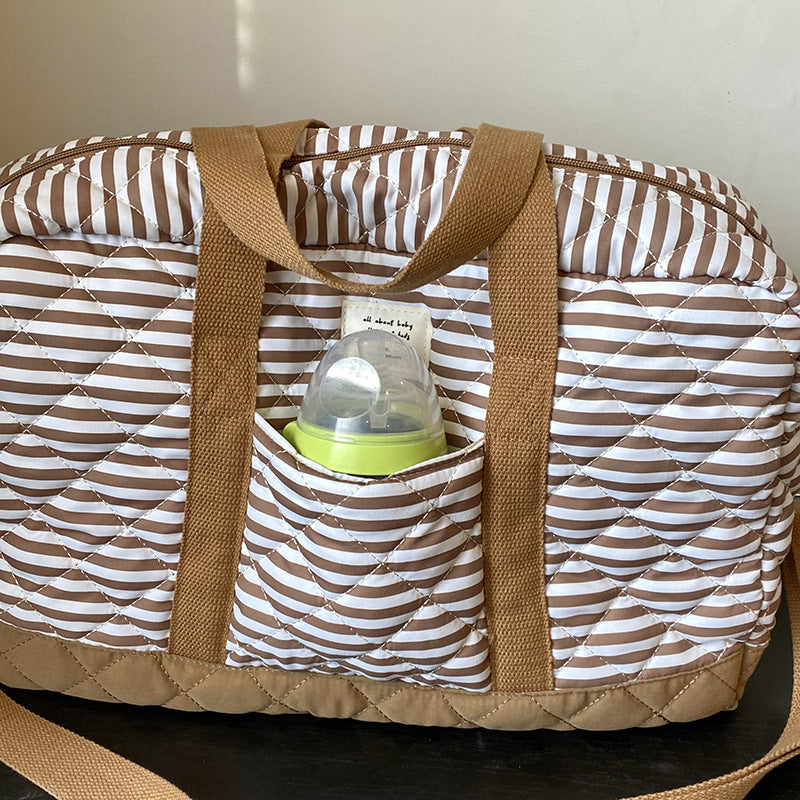 Fashion striped spring mommy bag for traveling, high-value hand-held mother and baby bag, large-capacity single-shoulder mommy bag