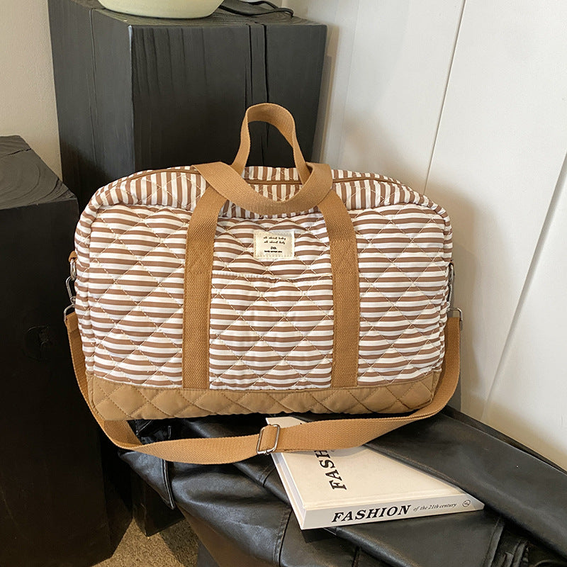 Fashion striped spring mommy bag for traveling, high-value hand-held mother and baby bag, large-capacity single-shoulder mommy bag