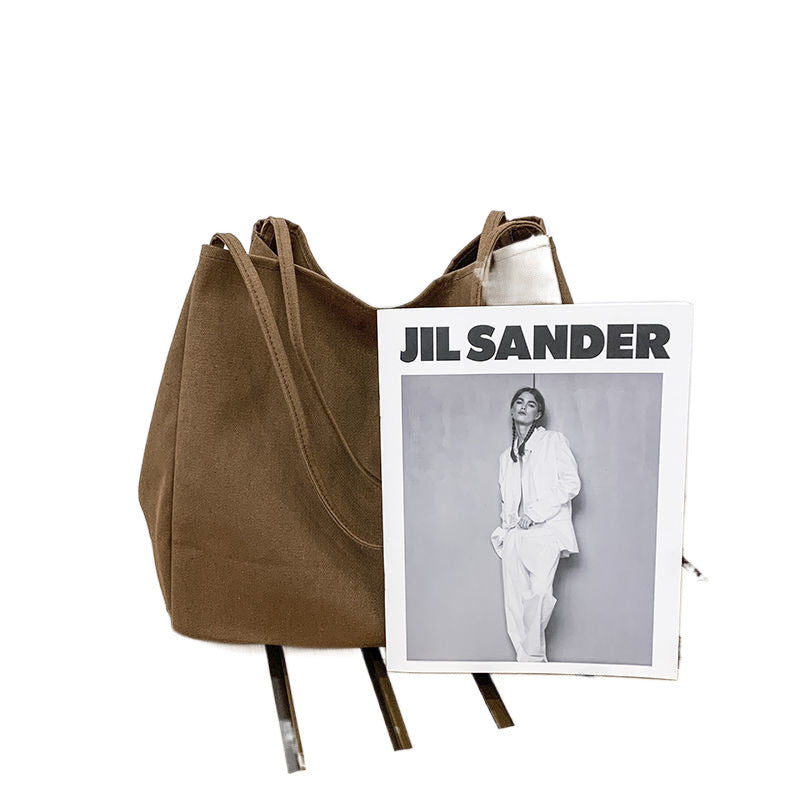 Japanese lazy style large capacity hand-held shoulder bag environmentally friendly shopping bag simple Korean version student literary canvas schoolbag