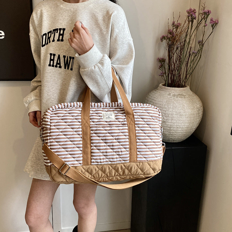 Fashion striped spring mommy bag for traveling, high-value hand-held mother and baby bag, large-capacity single-shoulder mommy bag