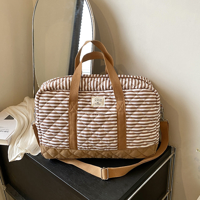 Fashion striped spring mommy bag for traveling, high-value hand-held mother and baby bag, large-capacity single-shoulder mommy bag