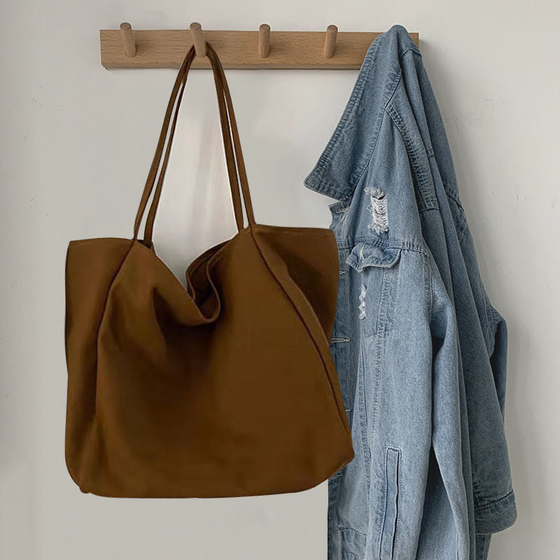 Japanese lazy style large capacity hand-held shoulder bag environmentally friendly shopping bag simple Korean version student literary canvas schoolbag