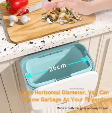 Kitchen counter with a trash bin and cutting board, showing the trash bin's dimensions.